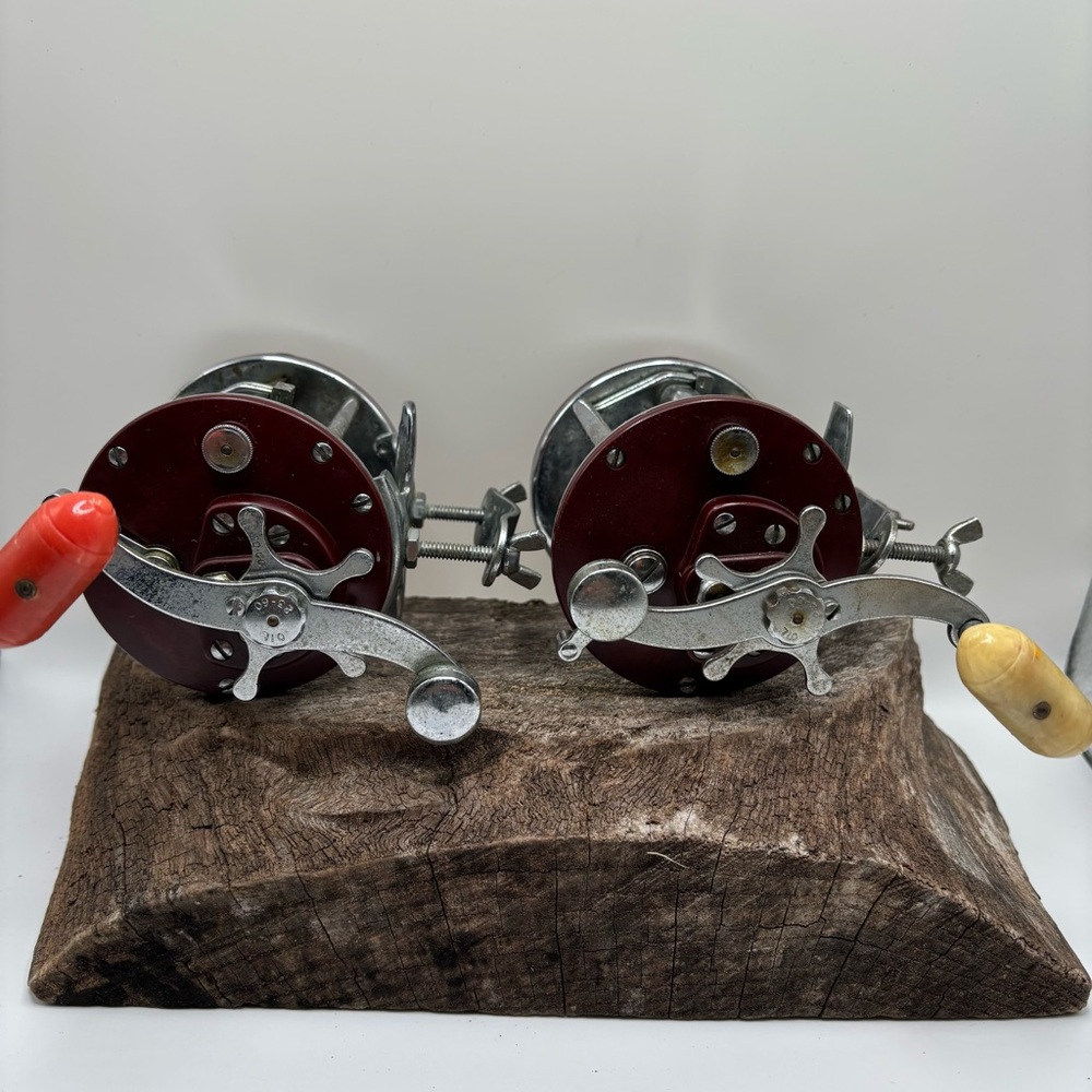 Vintage Penn Fishing Reels with Red and Cream Handles